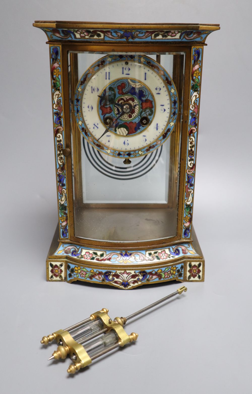 A late 19th / early 20th century French champleve enamel four glass mantel clock, height 27cm